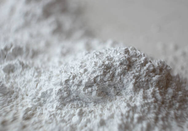 Scatter calcium carbonate powder. Close up photo.